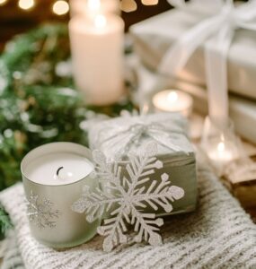 Elegant winter wedding setup featuring snowflake ornaments, cozy blankets, and candle favors, showcasing thoughtful and charming winter-themed guest gifts.