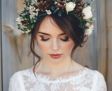 A beautiful winter wedding flower crown with seasonal foliage and delicate flowers, perfect for adding a magical touch to a winter bridal look.