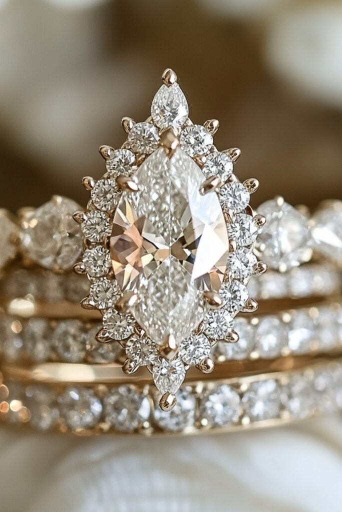 A bold marquise wedding stack with a diamond halo engagement ring and multiple pavé-encrusted bands for a luxurious and glamorous effect.