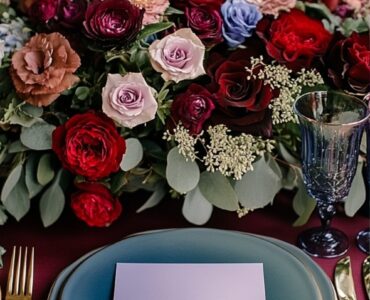 A romantic February wedding setup featuring a color palette swatch with vibrant red, serene blue, elegant purple, and lush green hues, symbolizing love and charm.