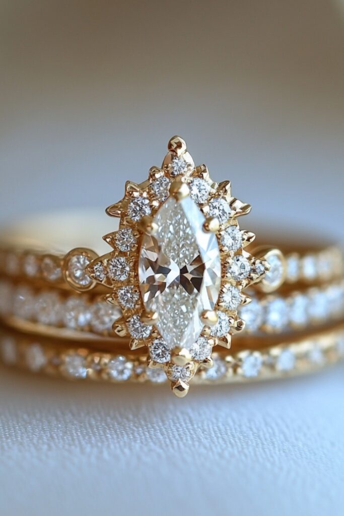 A marquise engagement ring with a diamond halo and contoured bands, creating a cohesive and sparkling wedding stack arrangement.