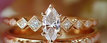 An elegant marquise wedding stack featuring a marquise engagement ring paired with diamond-accented wedding bands, set against a soft romantic background.