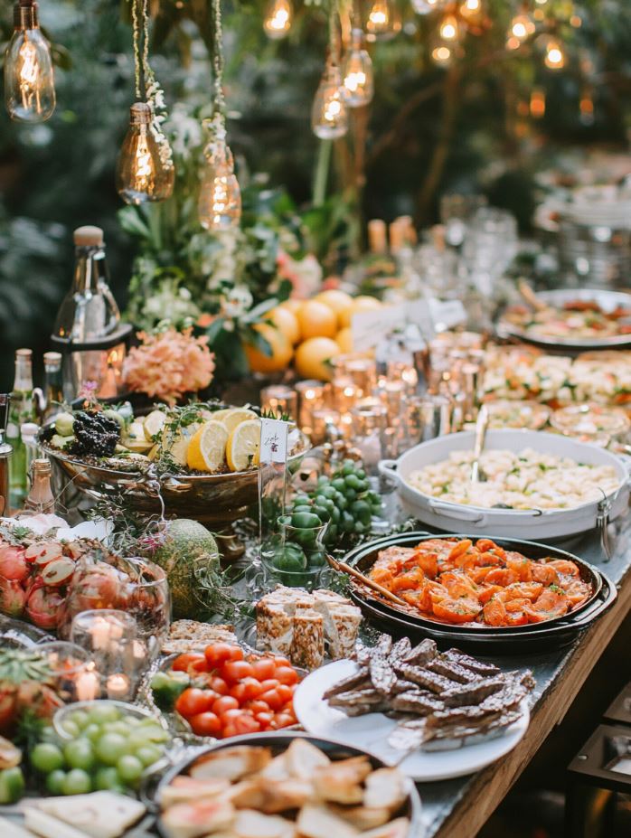 A buffet-style wedding reception featuring a variety of delicious dishes, offering an affordable and interactive dining experience for guests while reducing food costs.