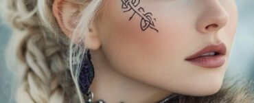 A bride in Viking-inspired makeup, blending bold warrior accents and natural aesthetics, featuring intricate runic designs and frosted winter tones, capturing the essence of Norse traditions.