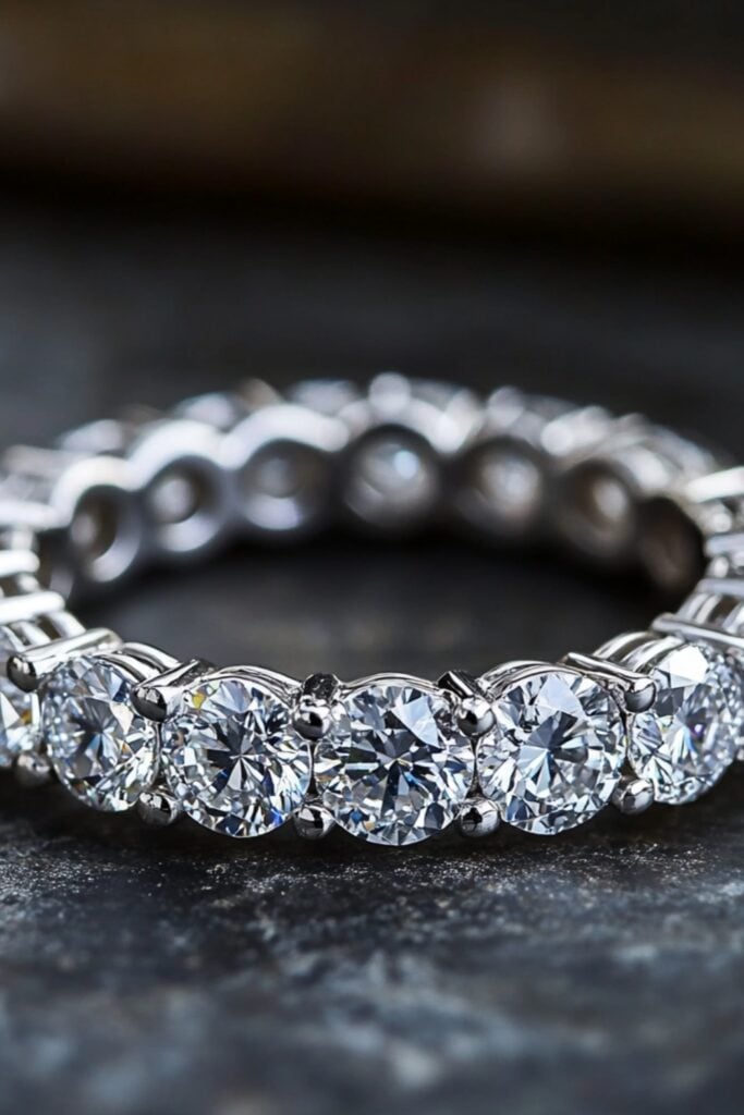 Classic vintage eternity band with a full circle of diamonds or gemstones, symbolizing eternal love and sophistication.