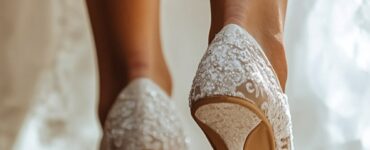 Close-up of a bride’s feet in stylish wedding heels as she steps forward, symbolizing confidence and the start of a beautiful journey.
