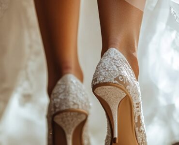 Close-up of a bride’s feet in stylish wedding heels as she steps forward, symbolizing confidence and the start of a beautiful journey.