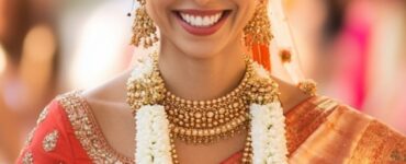 A glowing bride in a designer blouse and saree, walking confidently down the aisle, embodying elegance and reflecting her personal style on her wedding day.