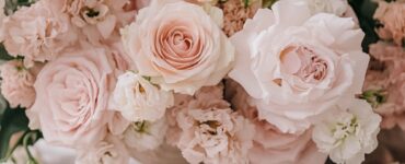 Wedding décor inspiration showcasing soft blush floral arrangements, pink invitations, and romantic accents that set the tone for a pink wedding theme.