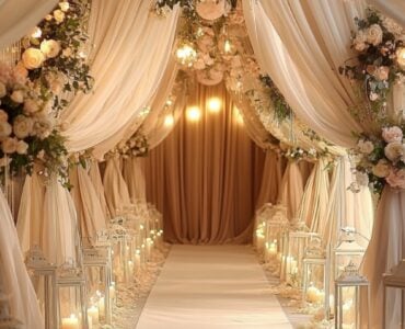 A beautifully decorated wedding aisle with soft floral arrangements, white drapery, and romantic candlelit lanterns, symbolizing the beginning of a love story.