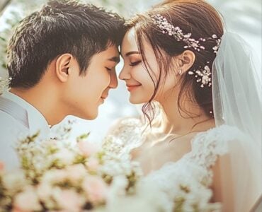 A photo album open to a romantic wedding picture, with soft floral decorations around it, representing the lasting memories and cherished moments captured from the couple’s special day.