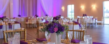 Image of a beautifully set wedding reception, highlighting a beautiful atmosphere created with budget-friendly choices and personal touches.